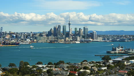 Auckland,-New-Zealand-city-skyline-as-seen-from-across-Shoal-Bay---pullback-zoom-out-reveal