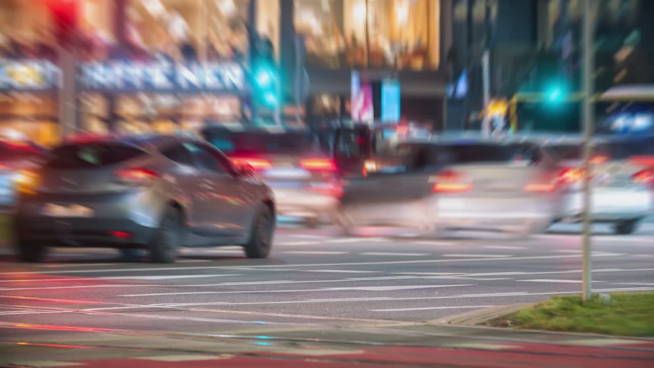 Bokeh blurred car traffic jam on busy city roundabout crossroad in evening. Timelapse rush hour roadway downtown. Unrecognizable cars in fast motion at night. Headlights trails, urban life concept