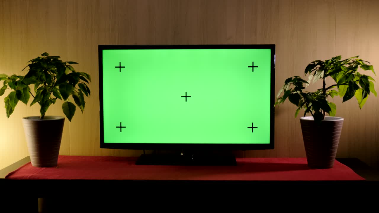 TV with green screen composited. TV or television - green screen - room - on the table. LCD TV with track green screen in modern livingroom