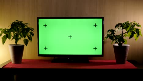 tv with green screen composited. tv or television - green screen - room - on the table. lcd tv with track green screen in modern livingroom