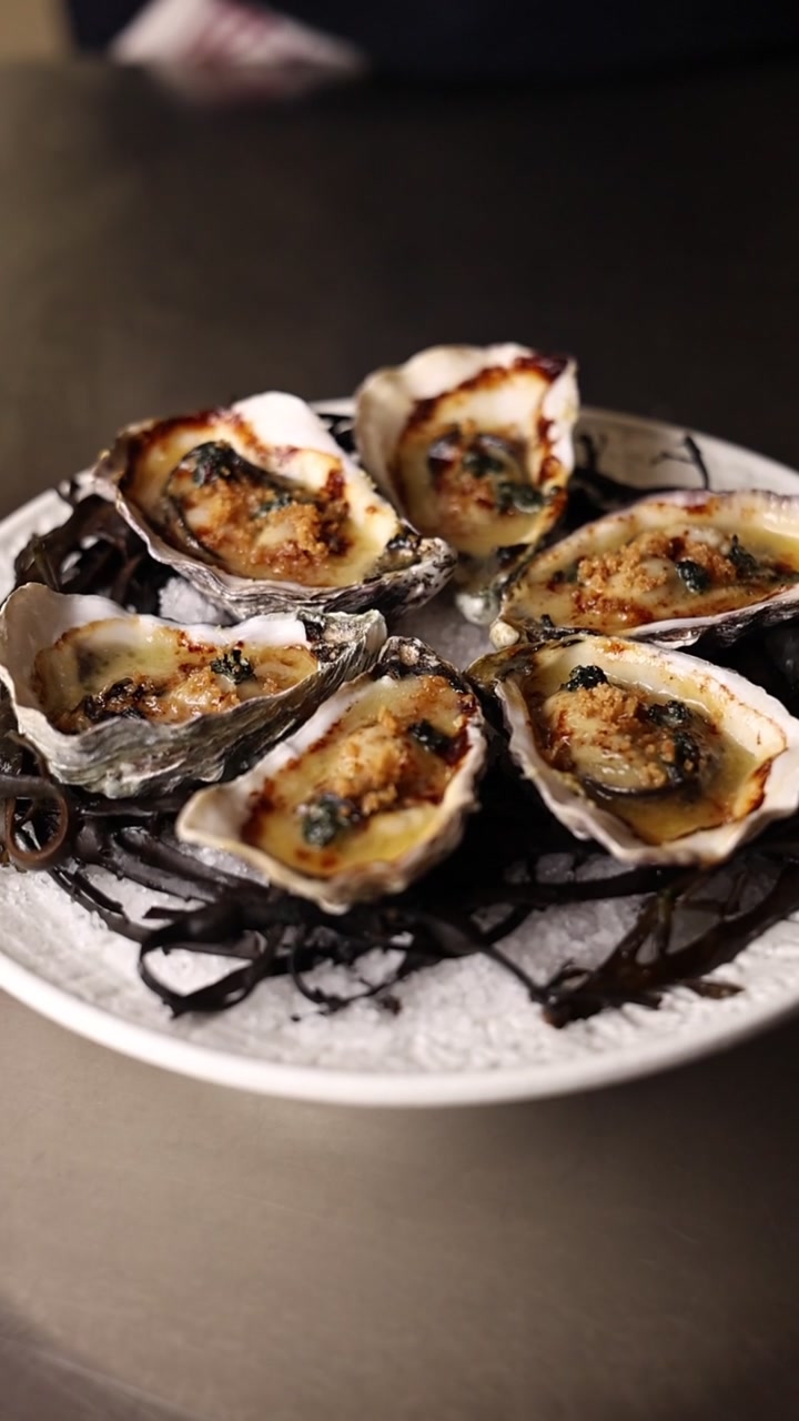Platter of Baked Oysters Served on Seaweed