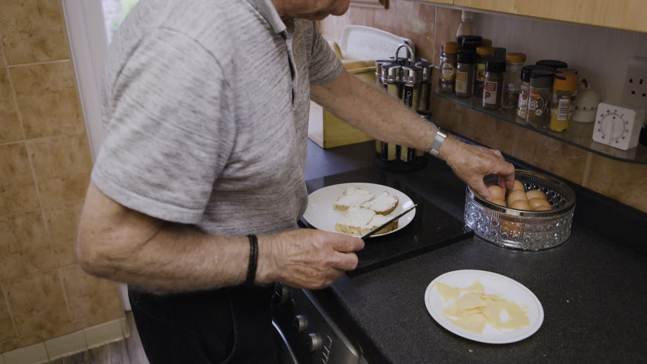 Senior man preparing a breakfast in the kitchen