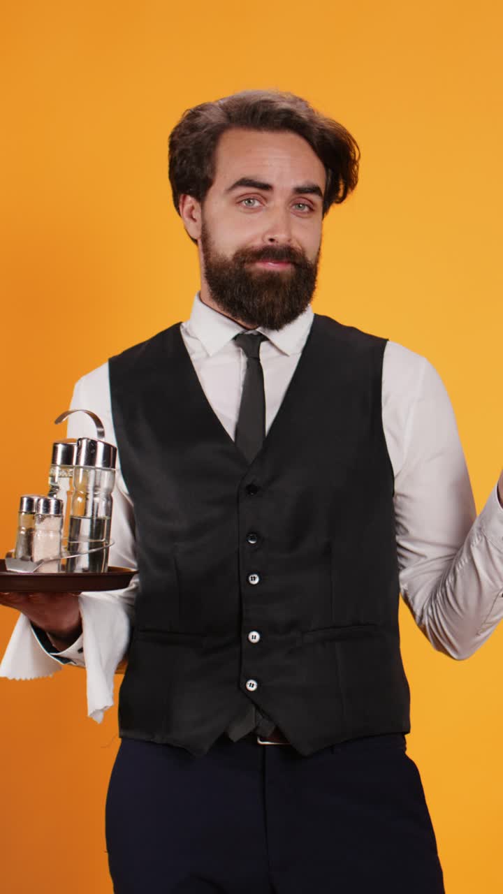 Vertical video Shocked waiter with surprised reaction