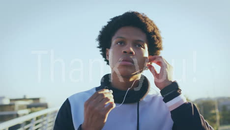 animación de texto de agradecimiento sobre corredor biracial con auriculares