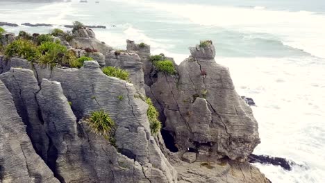 Drone-view-of-the-pancake-rocks-at-Dolomite-point,-Punakaiki,-New-Zealand