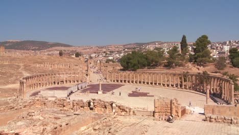 A-low-angle-shot-looking-up-at-pillars-in-the-Roman-city-of-Jerash-in-Jordan-1