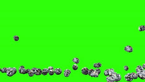 Crumpled-usa-dollars-bills-balls-falling-on-green-screen