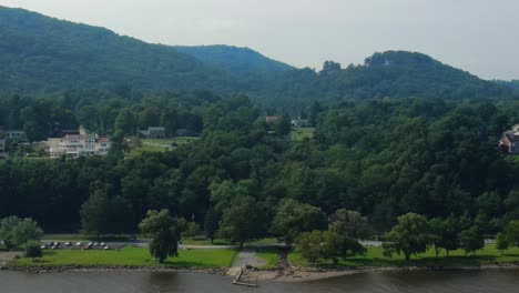 aerial drone video footage of cornwall on hudson in orange county new york, in new york's hudson valley as seen from the hudson river with the appalachian mountains in the background