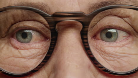 close up macro eyes old woman wearing glasses aging beauty healthy eyesight concept