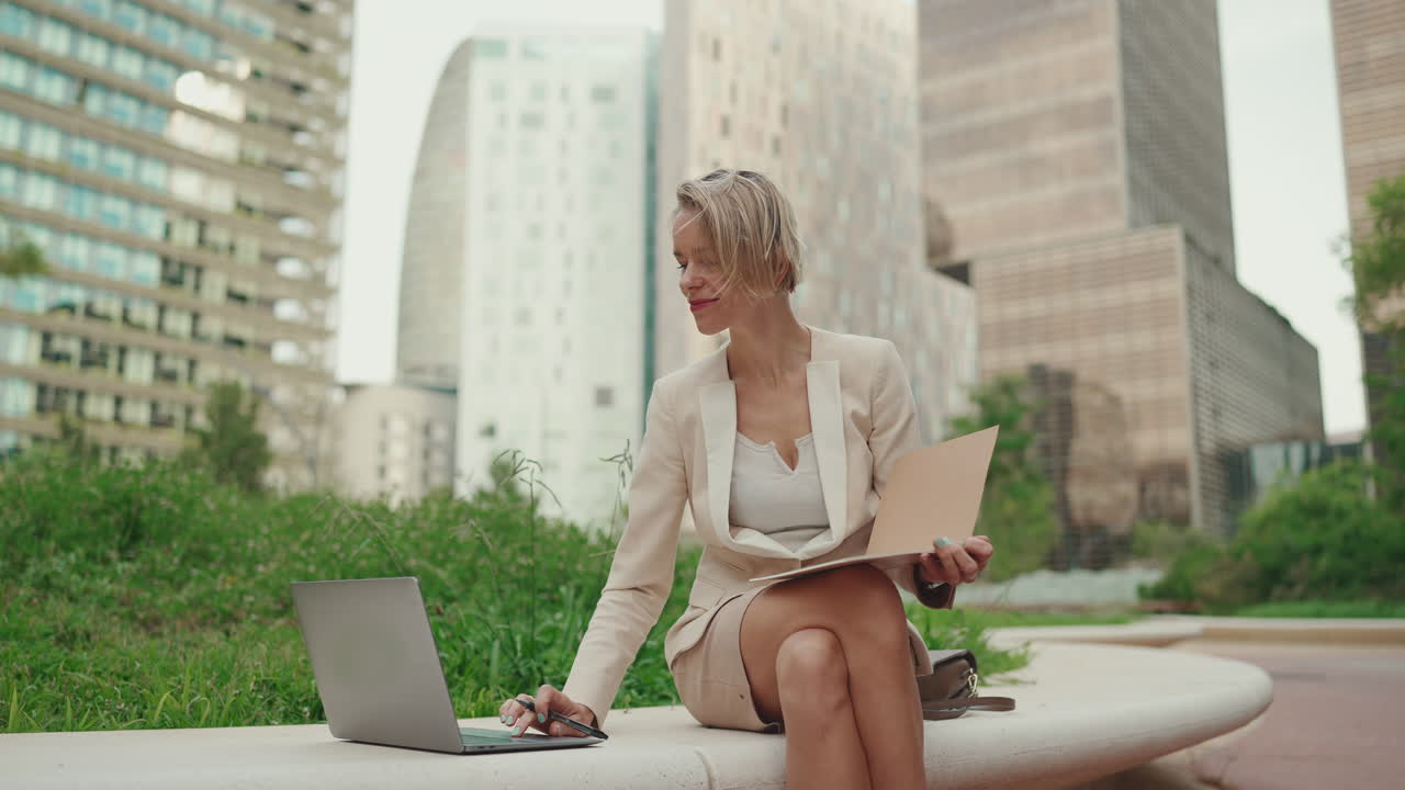 Businesswoman working outdoors