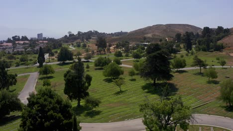 Low-aerial-rising-shot-over-a-burial-lawn-with-rows-of-headstones-at-a-California-mortuary