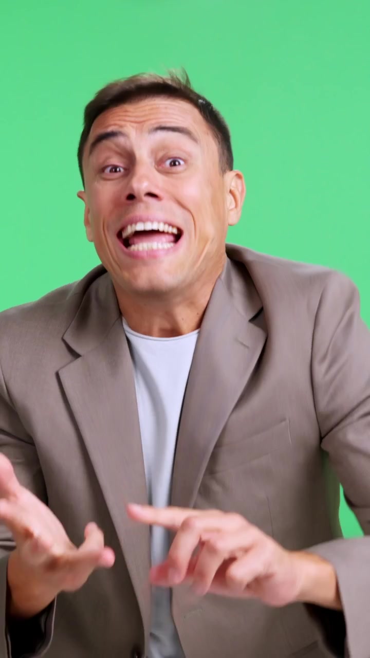 Man counting on fingers and celebrating against a green screen