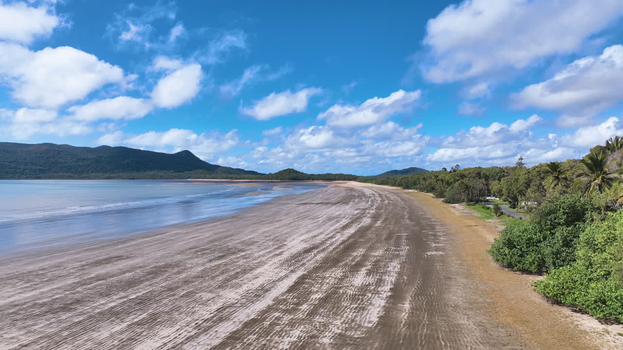 Aerial flies low over Ball Bay's incredible sand with detailed ridges Queensland
