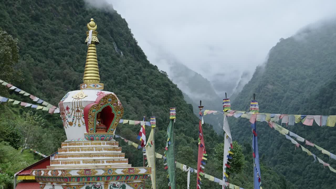Buddhist Temple in Himalayas Mountains in Nepal, Buddhist Religious Building in Nature with Beautiful Dramatic Mountain Scenery in Lush Green Landscape on the Annapurna Circuit Trekking Route