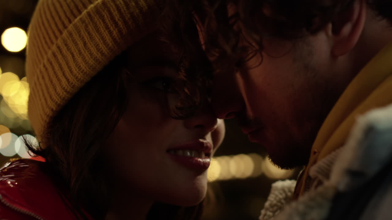 Affectionate couple cuddling on city street