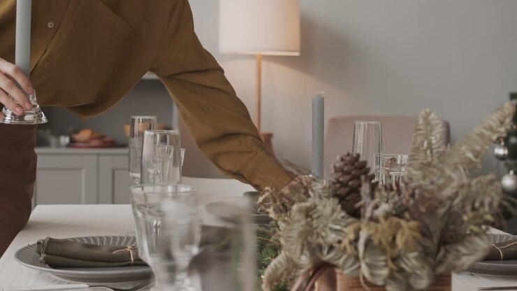 Lighting Candles on Christmas Table