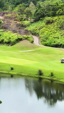 lush green golf course landscape with water feature in phuket