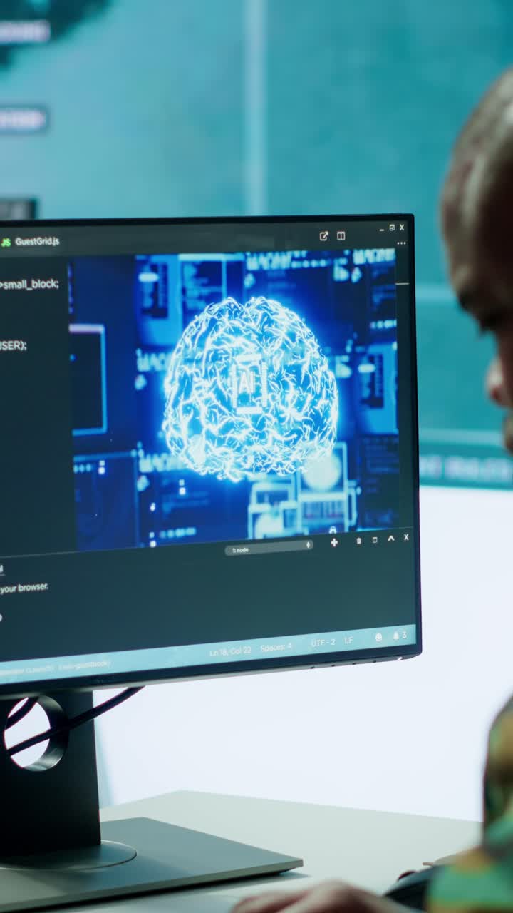 Vertical Video Military specialist monitors satellite data real time information on computer