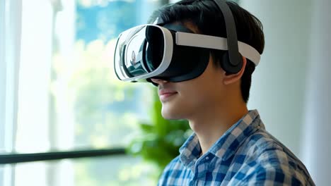 a young man wearing a virtual reality headset