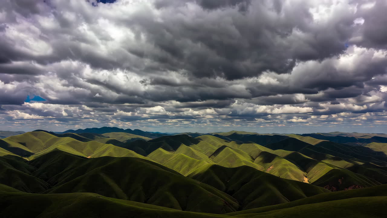 Mountainous Landscape Under Dramatic Sky