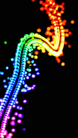 abstract glowing rainbow light trails on black background