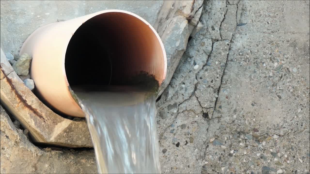 Irrigation system in Andalusia. Elevated Concrete irrigation canal dropping down a level in countryside in Andalucía