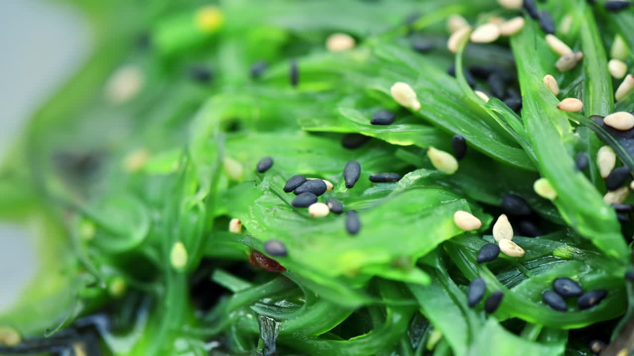 Close view of seaweed with seeds in a bowl