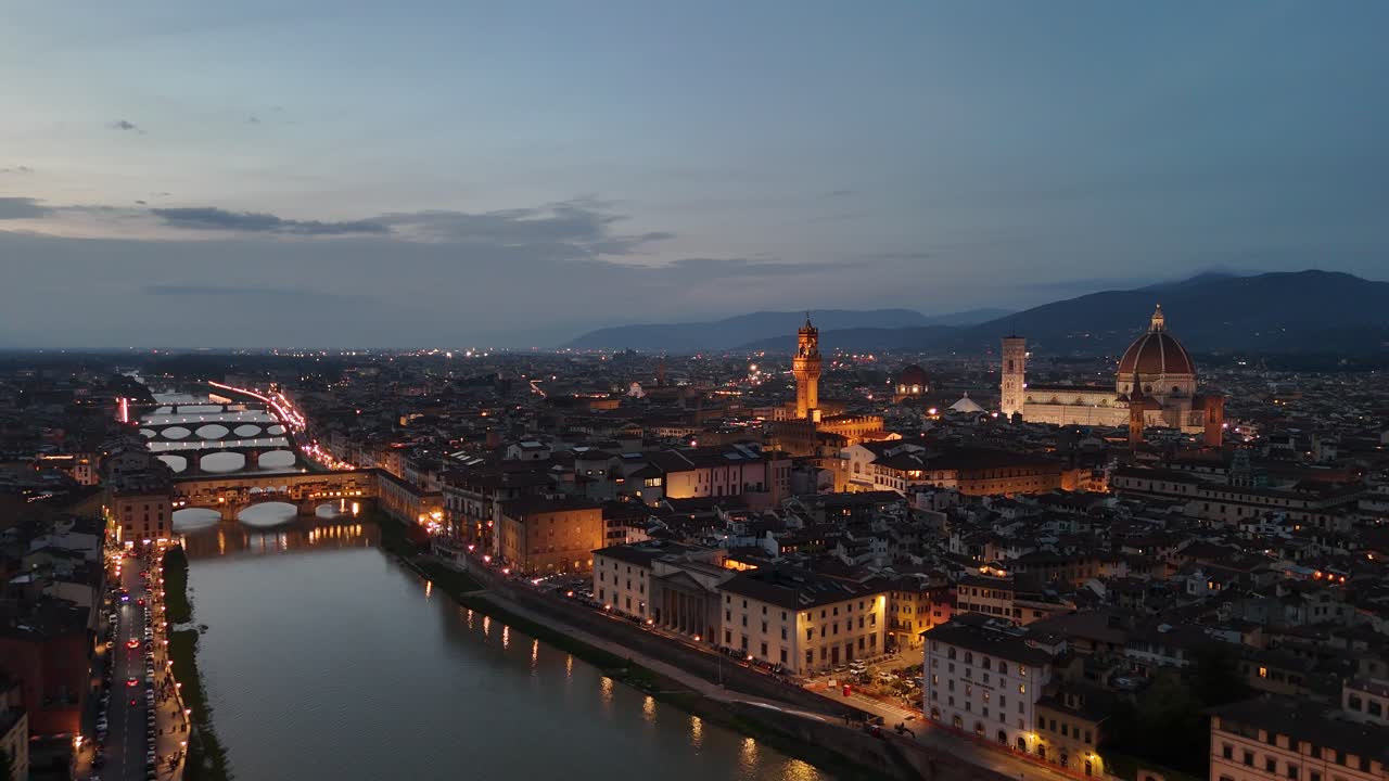Stunning aerial footage of Florence-Firenze (Italy) at dusk. [Drone movement: pitch backwards]