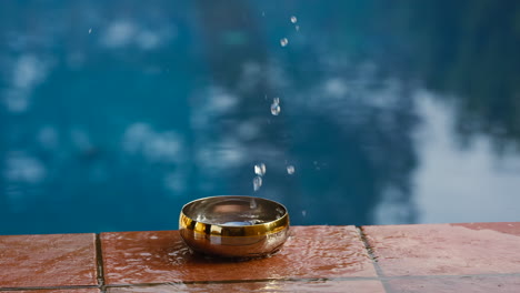 water splashing in a small bowel sending ripples outwards in a circular pattern