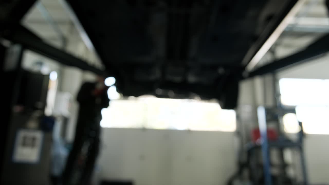 Car Undercarriage Maintenance in a Garage