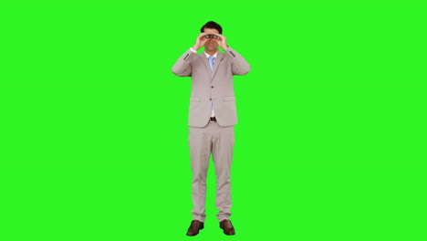 Businessman-looking-through-binoculars