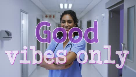 animation of good vibes only text over smiling biracial female doctor