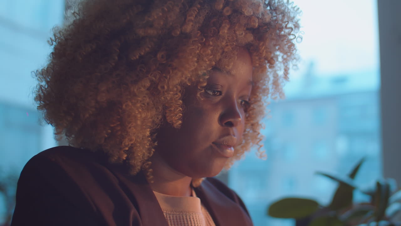 African American Businesswoman Using Laptop in Office