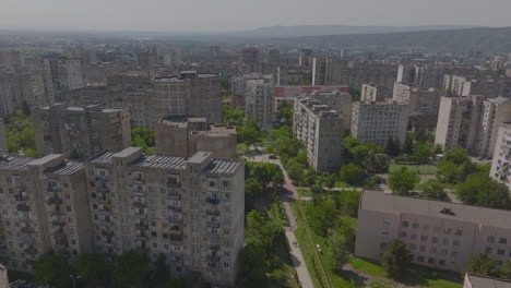 aerial view of old soviet era housing buildings architectural style and residential blocks with cars parked inside it, tbilisi, georgia