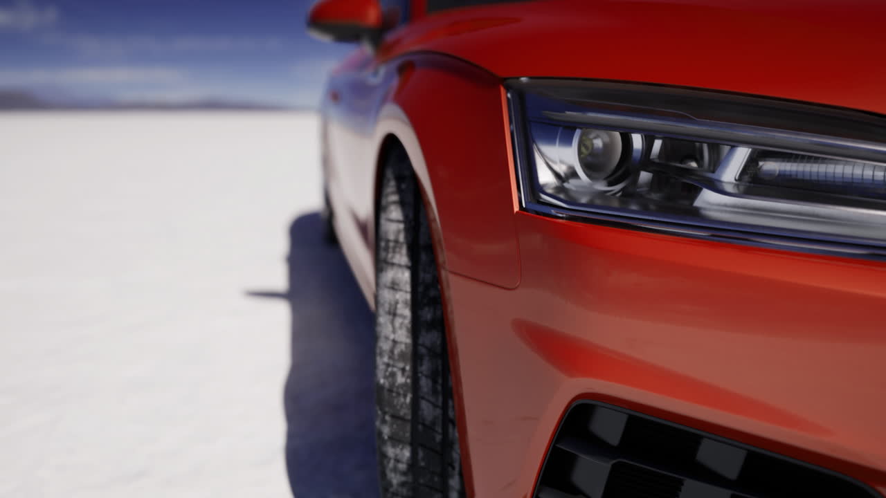 Close view of an orange vehicle on a snowy landscape under a clear sky