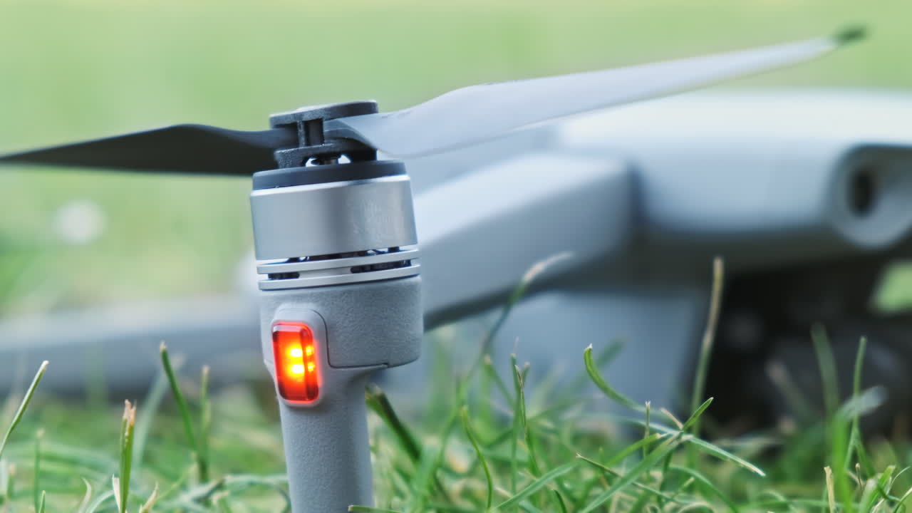Close-up shot of a drone lying on the grass