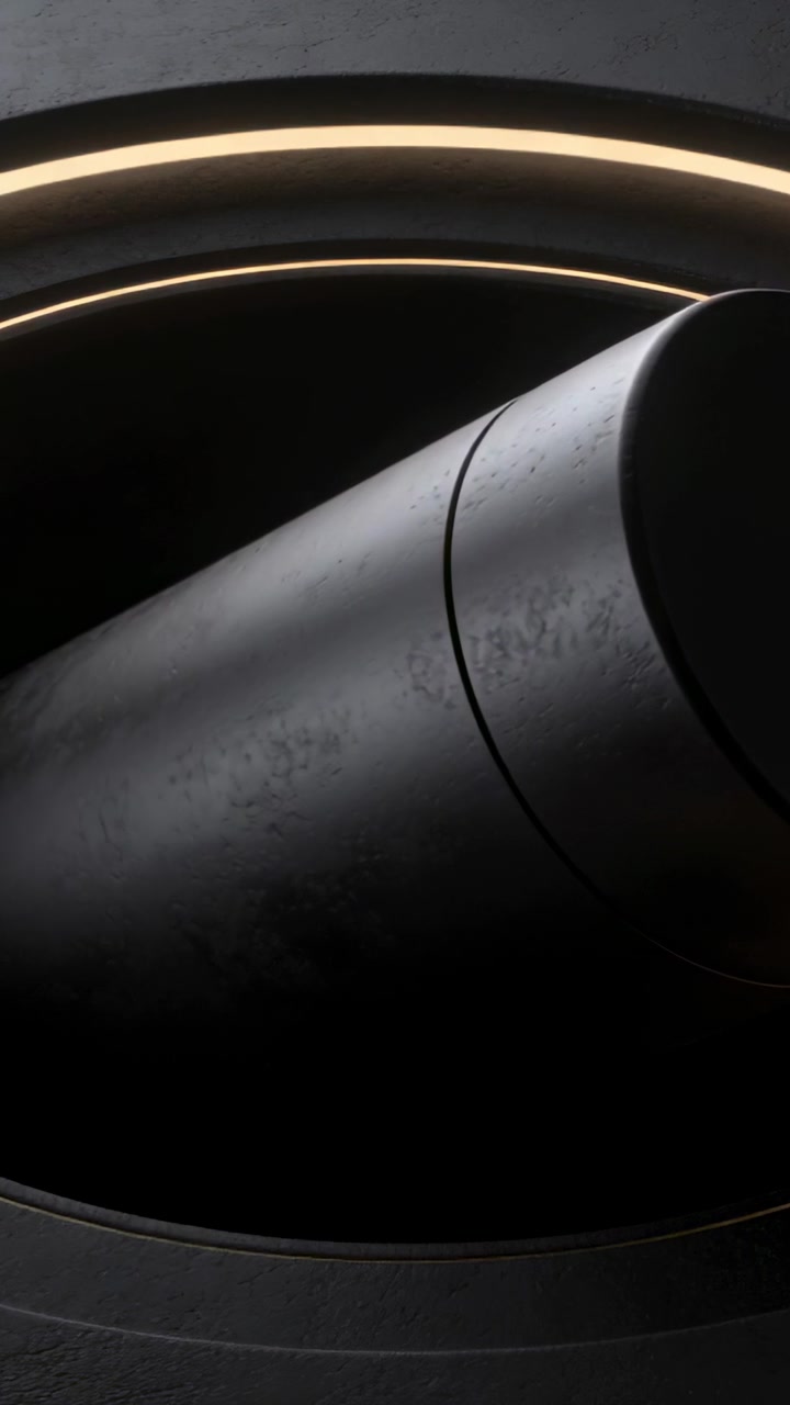 Vertical video: Shifting matte cylinder clockwise in studio cradle, showing seam, cap, warm LED rim