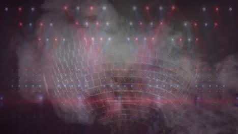 animación de puntos de luz y efecto de humo sobre una pelota de discoteca giratoria contra un fondo negro