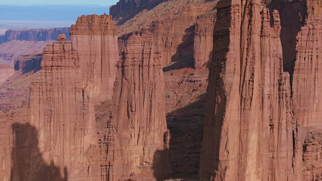 Rising aerial view of Moab's red rock formations at Fisher Towers