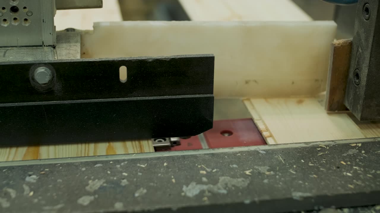 Wood Planks Moving Through Industrial Processing Machine