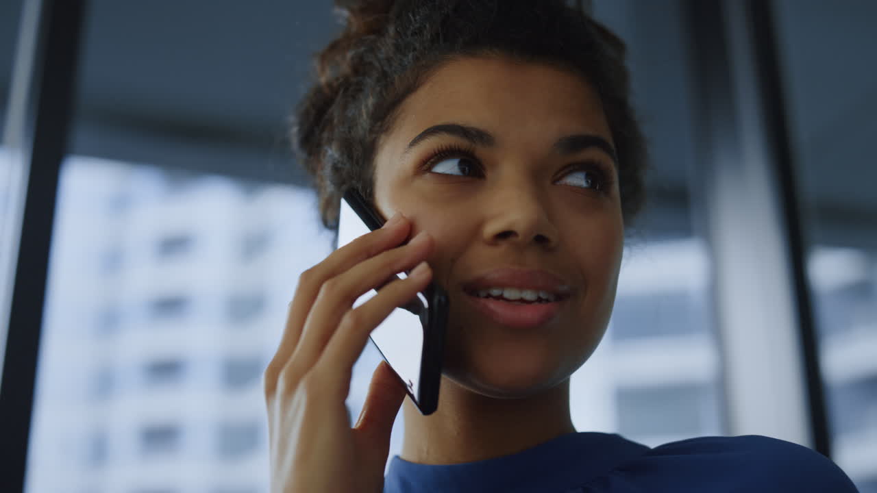 Businesswoman taking on smartphone. Female executive having phone call