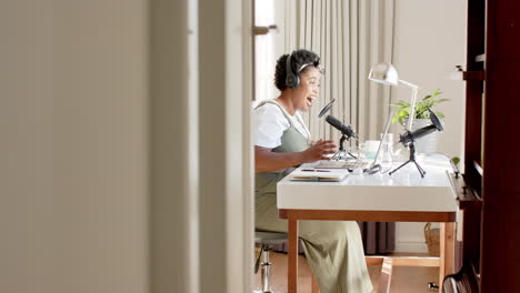 african american woman records a podcast at home with copy space