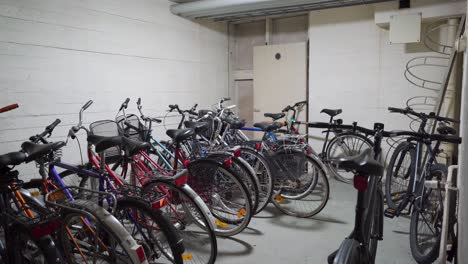 bunch of bicycles in a bicycle storage room