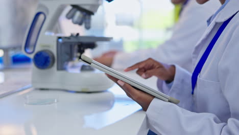 hands, tablet and typing in laboratory for science