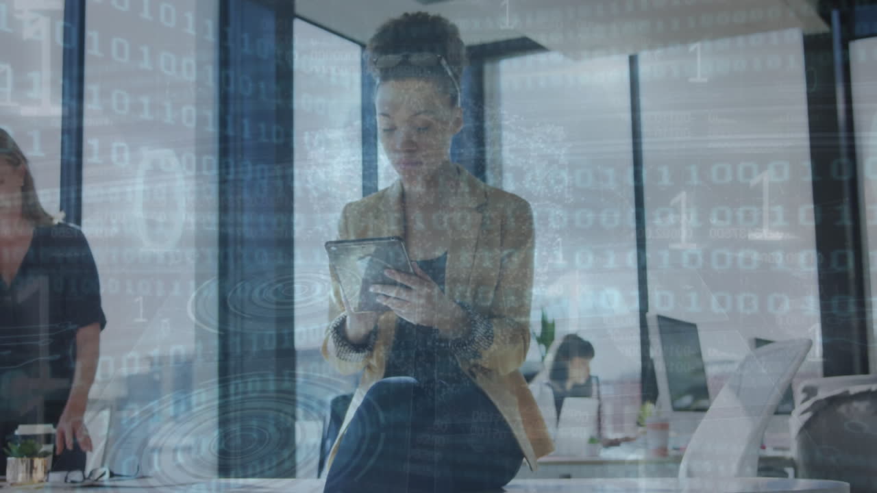 Animation of binary coding data processing over biracial businesswoman using tablet in office