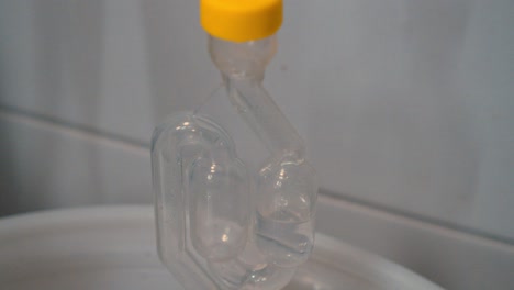 close-up of a safety tube with boiling clear liquid in a laboratory experiment