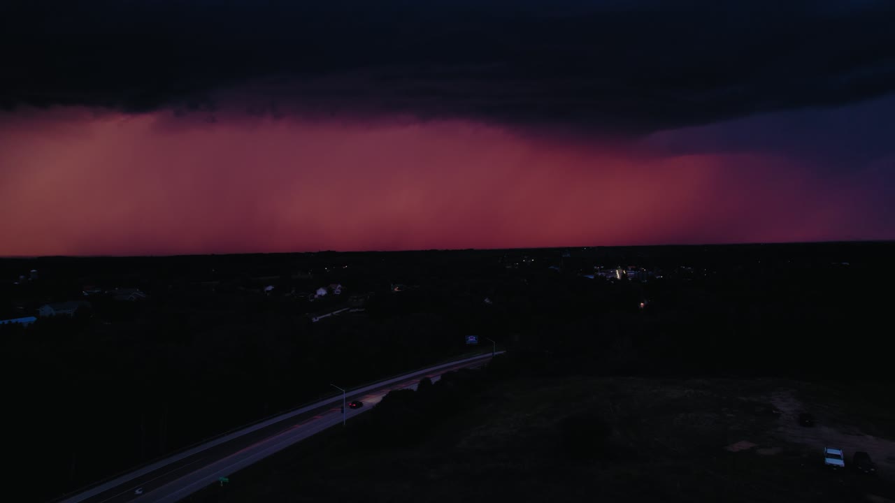 Wisconsin massive lightning storm rolling over the horizon in rural Wisconsin