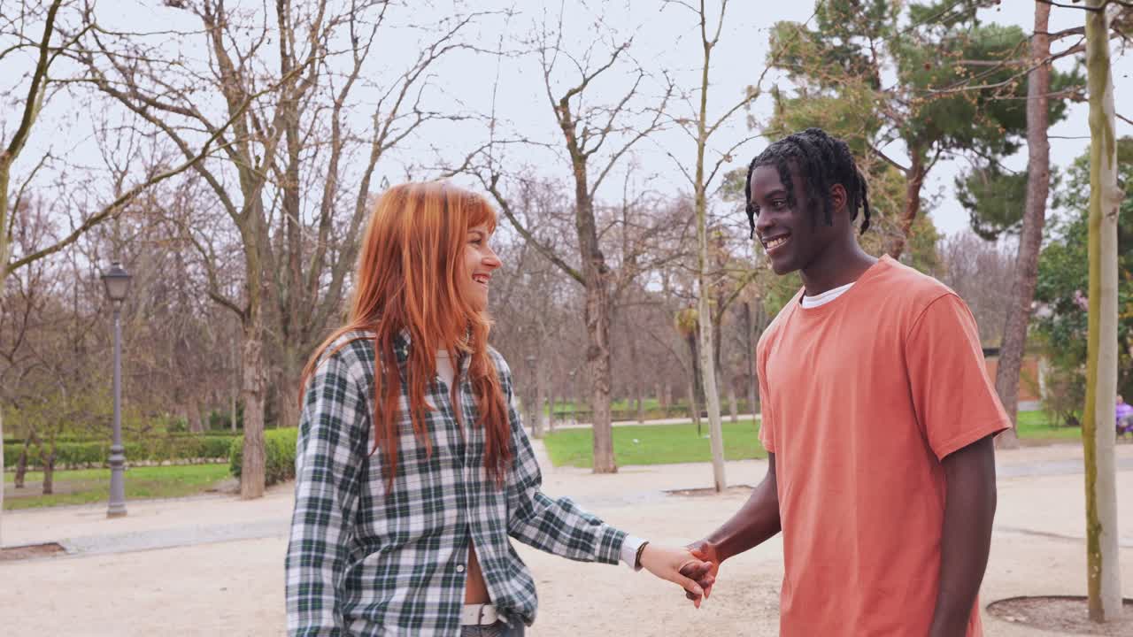 Affectionate friends enjoying time together in a park