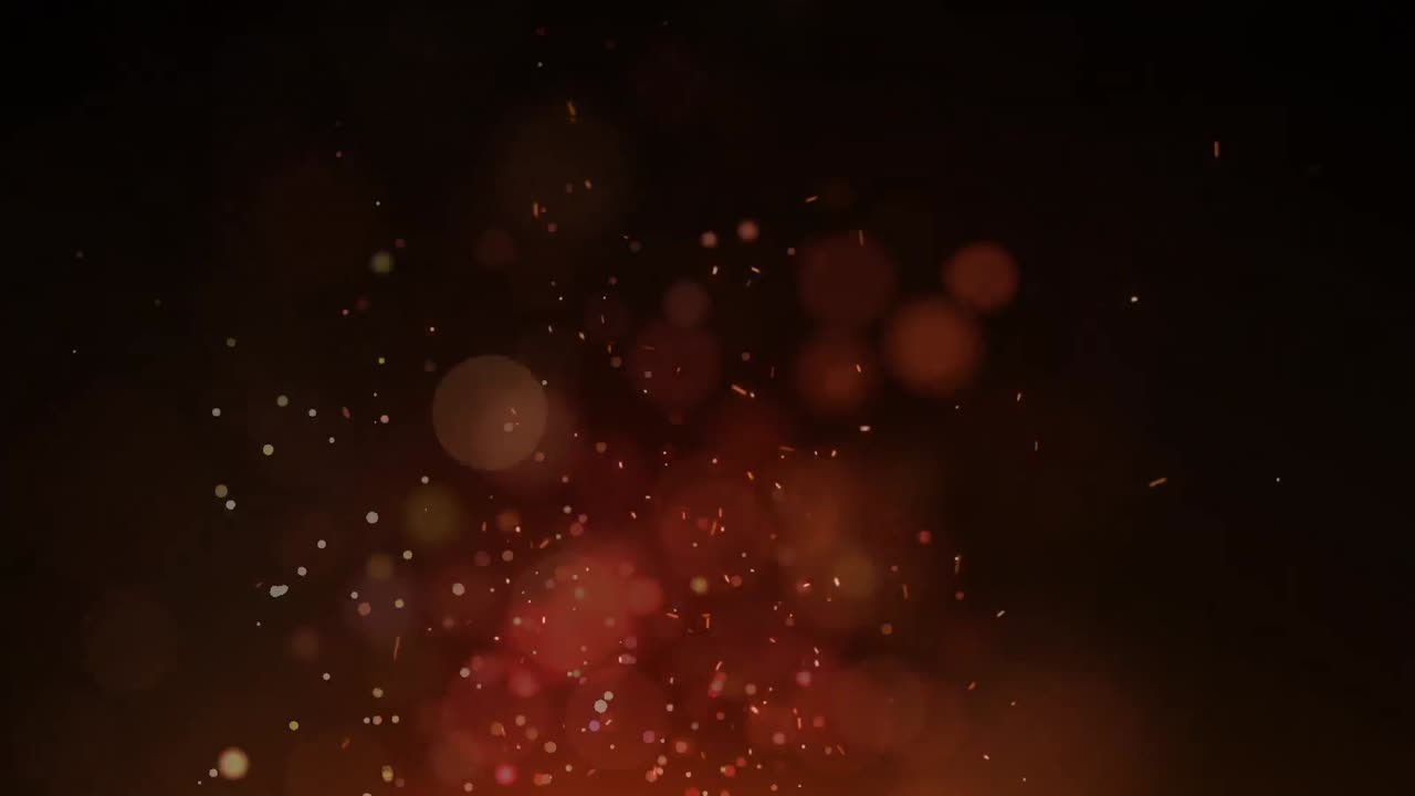 Animation of digital fire sparks and lens flares moving in seamless loop over black background