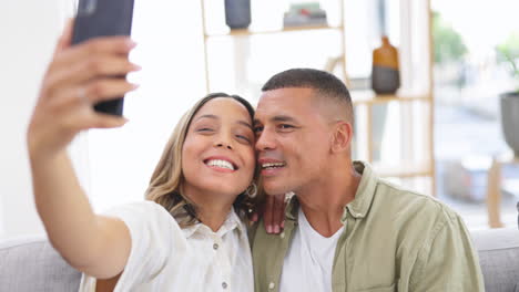 couple, selfie and smile on living room sofa